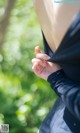 A close up of a person wearing a black shirt.