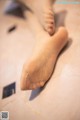 A close up of a person's foot with a bandage on it.